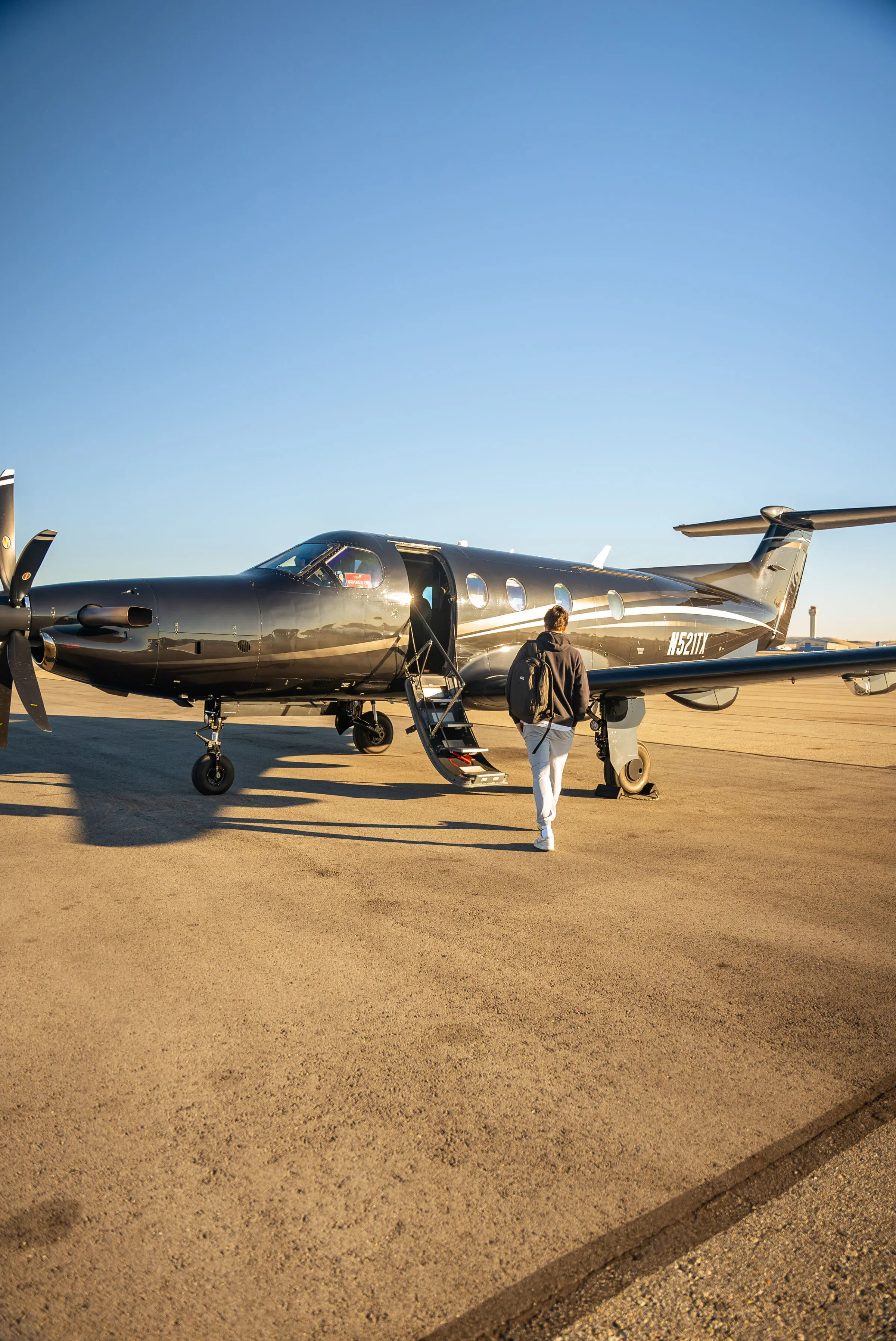 Grit Rep walking to private jet